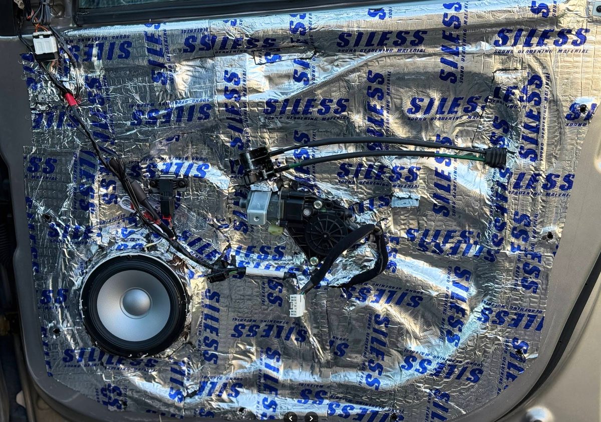 Door skin treated with Siless sound deadening around a new component speaker